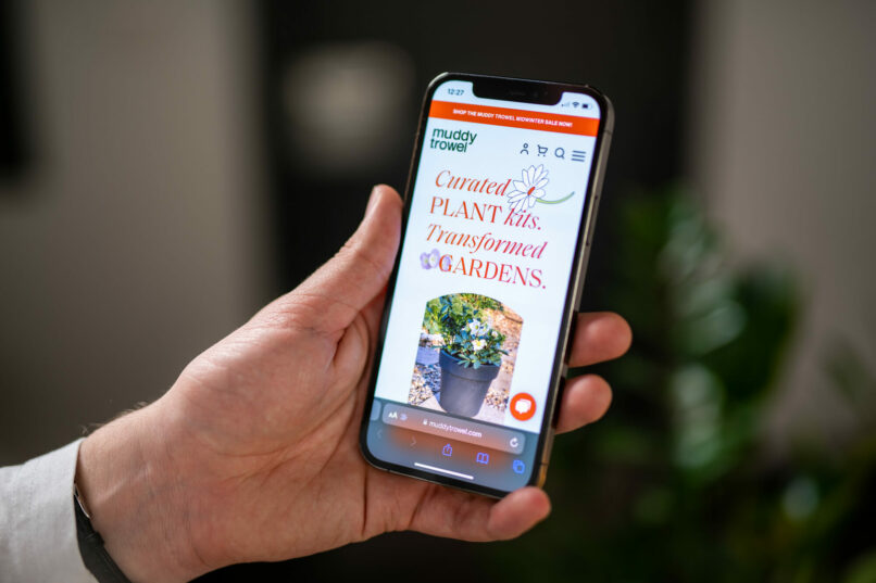 Mobile device showing UI design from e-commerce website